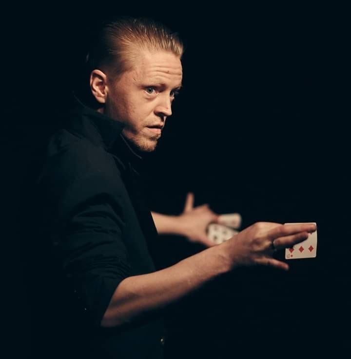 Street magician performing